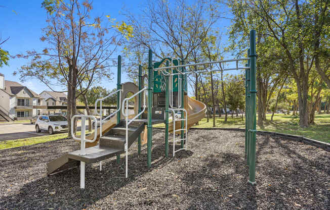 Our playground with a slide at On the Green apartments in Austin, TX