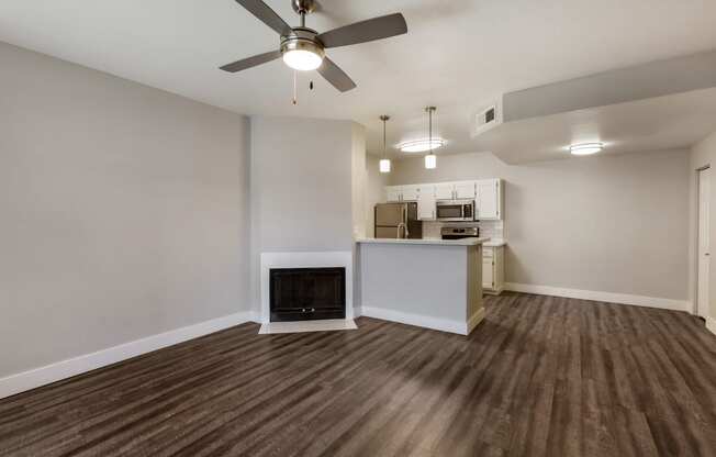 Enjoy the cozy ambiance of our living room, complete with a crackling fireplace at Boulders at Lookout Mountain Apartment Homes, Arizona