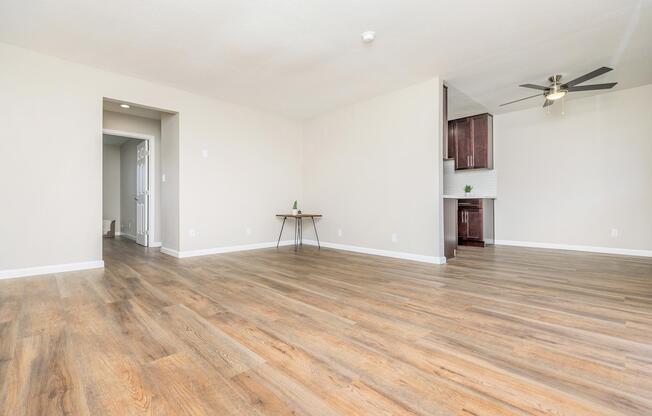 a large empty room with a wooden floor