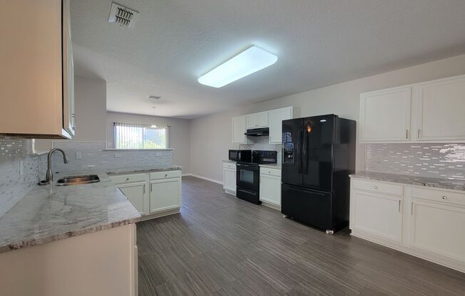 Beautiful 4-Bedroom Home with Dual Primary Suites in Amberwood!