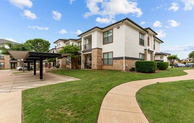 A modern two-story building with a covered walkway in front.