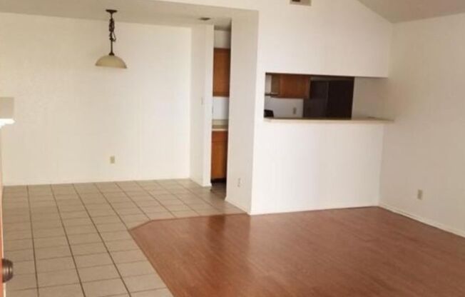 Open Concept, Wood burning fireplace with Ceramic Flooring
