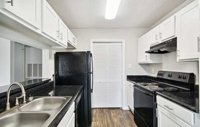 a kitchen 
at Sabal Point Apartments in Pineville, NC