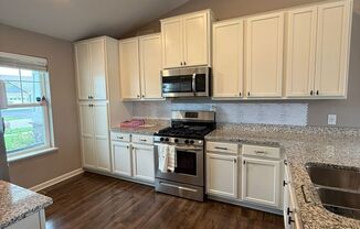 Spacious 4 BD | 2 BA Home with Finished Lower Walkout | 3‑Car Garage | Woodbury