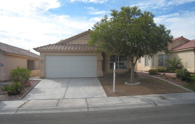 Single story with tile flooring and gas fireplace.