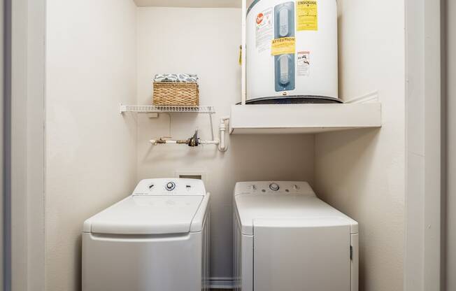 A laundry room with a washer and dryer.