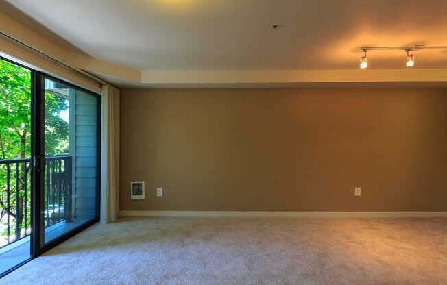 Carpeted Living Room with Private Balcony