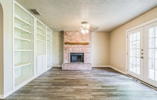 Spacious 4-Bedroom Home with Open Floor Plan & Brick Fireplace