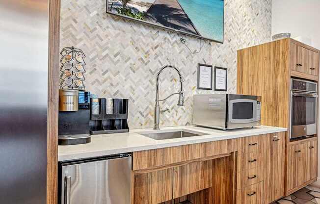 a kitchen with a sink and a microwave