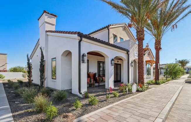 the exterior of a house with palm trees and a sidewalkat Stella, San Tan Valley, AZ 85143