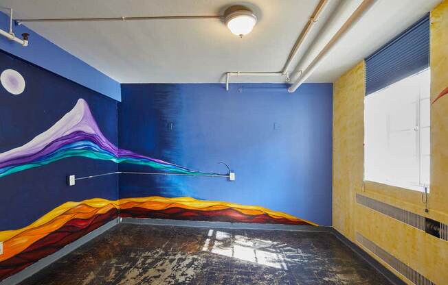 mural of a wave on the wall of a room at MILEPOST 5 Apartments, PORTLAND