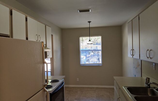 2/2 Flat with Assigned Parking, Screen Porch, Inside Laundry