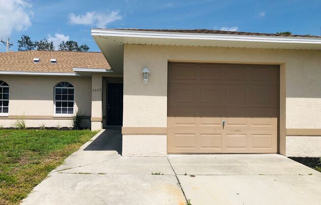 3 Bedroom 2 Bath SW Cape Coral Duplex with Garage and Screened Lanai