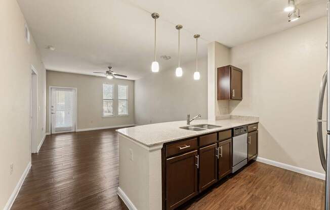 A kitchen with brown cabinets and a white countertop.