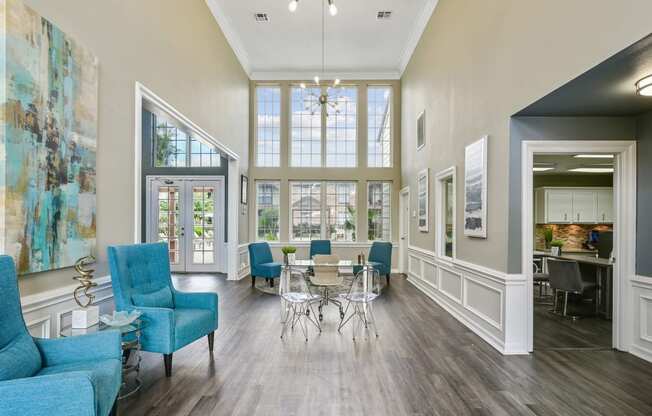 a living room with blue furniture and a large window