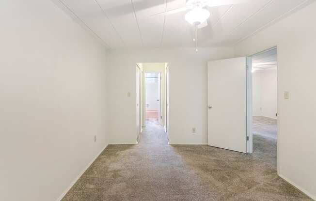 This is a photo of the bedroom of the 550 square foot 1 bedroom, 1 bath patio apartment at College Woods Apartments in the North College Hill neighborhood of Cincinnati, OH.