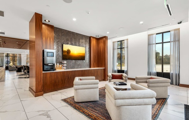 a living room with couches and chairs and a television at The Colony, Charlotte, NC, 28211