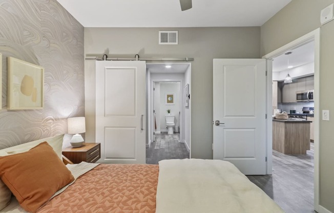 Bedroom with a bed and a bathroom in the background at Array La Mesa, California, 91942