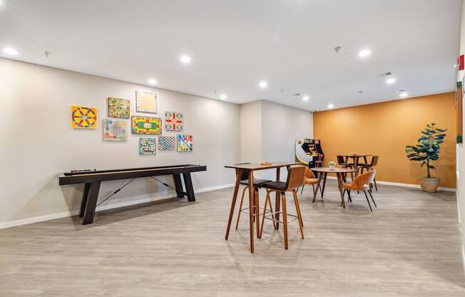 a dining room with a table and chairs and a pool table