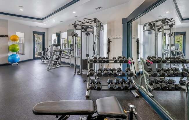 Fully-equipped fitness center with weights - Lantern Woods Apartments