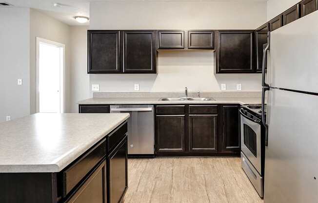 Kitchen with stainless steel appliances at Tamarin Ridge in Lincoln, NE