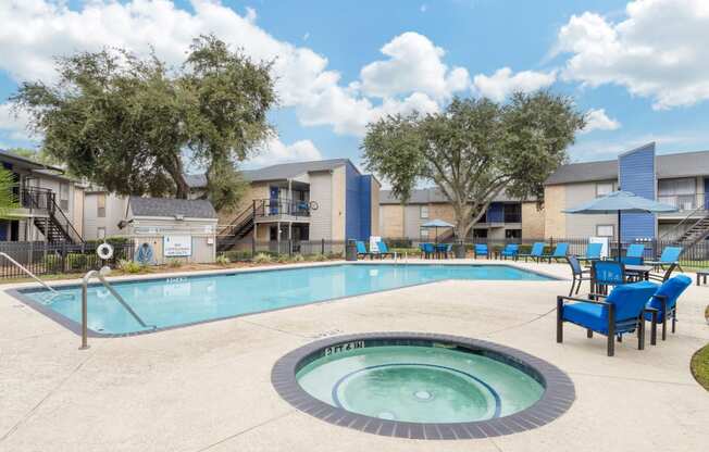 our apartments have a swimming pool with chairs and umbrellas