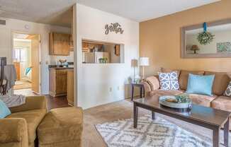 Foothills living room with carpet flooring and couches for relaxation