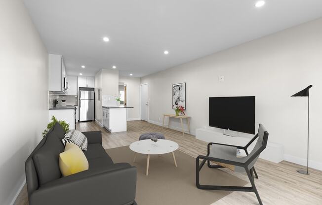 a living room with a couch and a coffee table and a television