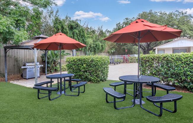 a group of lawn chairs sitting on top of a picnic table