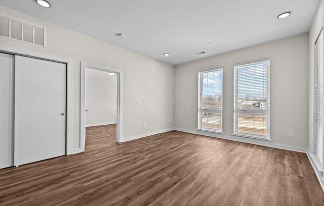 A room with wooden floors and white walls.