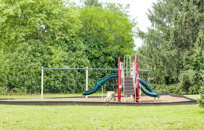 Playground with slides and swing sets at University Park Apartments