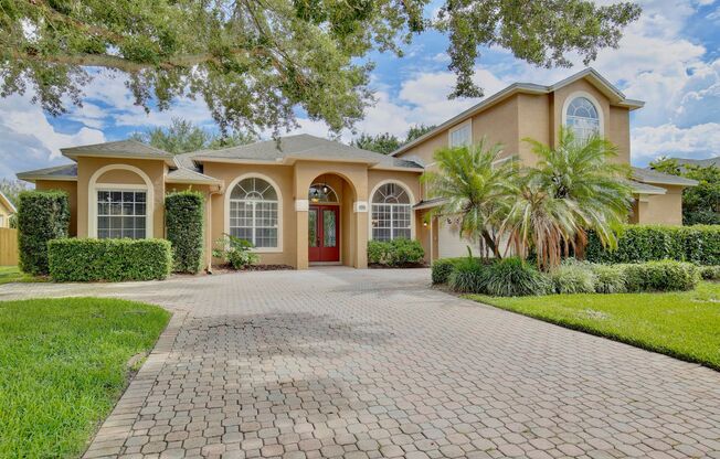 Stunning 4/3 Pool Home with a Bonus Room and a 2 Car Garage in the Desirable Cambridge Crossing - Winter Garden!