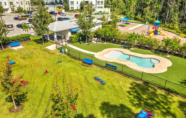 an aerial view of the resort style pool and hot tub