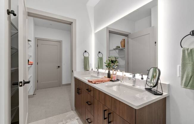 a bathroom with a large mirror and a sink at The Mera, Minnesota