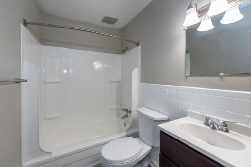 a bathroom with a sink toilet and a shower