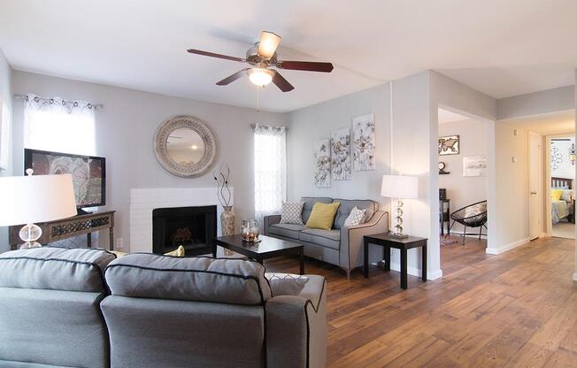 a living room filled with furniture and a fire place