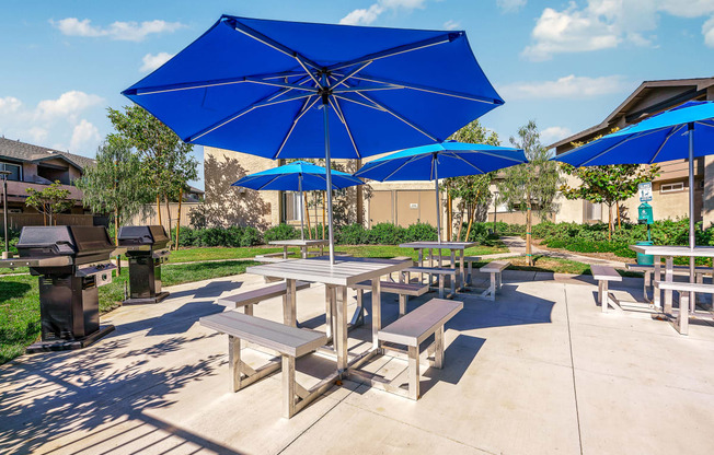 the reserve at bucklin hill picnic tables with blue umbrellas