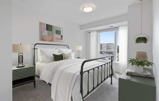 a bedroom with a large bed and a window