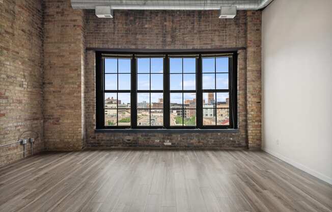 an empty room with a large windowat Gaar Scott Historic Lofts, Minnesota