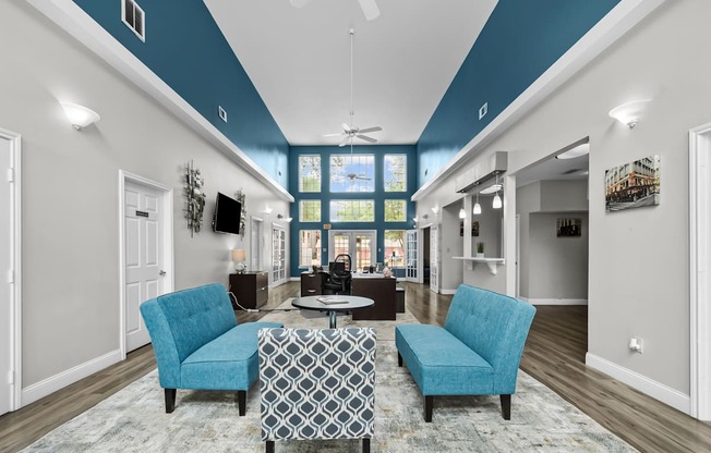 A living room with a blue and white color scheme.