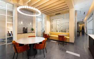 a dining room with a table and chairs