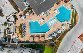 arial view of a swimming pool on top of a property