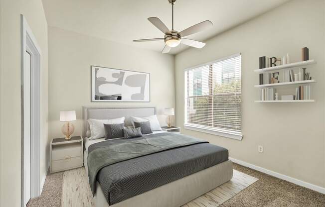 a bedroom with a large bed and a ceiling fan