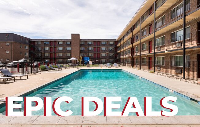 A pool in front of apartment buildings with the words 