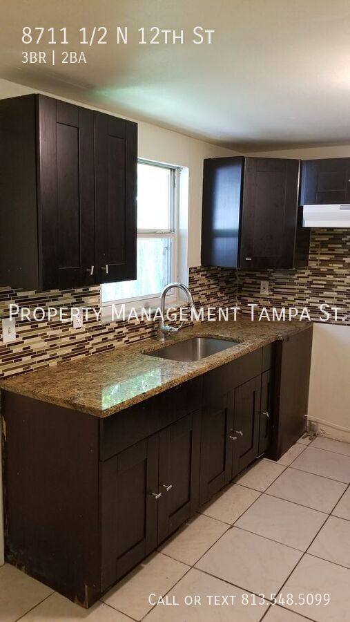 8711 1/2 N 12 ST