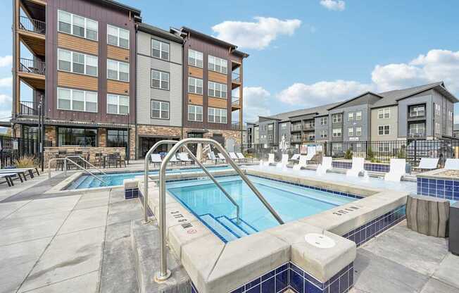 our apartments have a large swimming pool in front of our buildings at The Quarry Luxury Apartment Homes, Fort Collins, CO, 80526