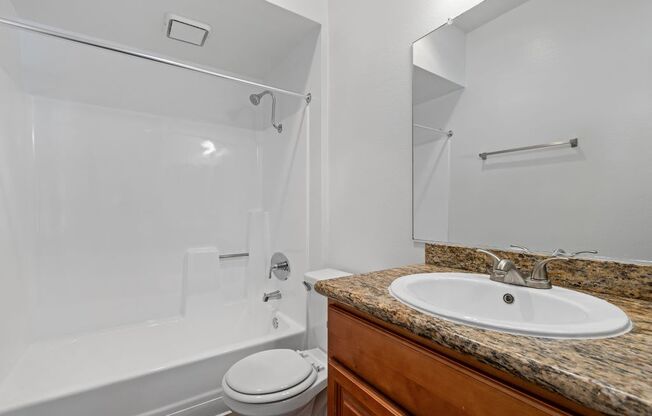 a bathroom with a sink toilet and a shower