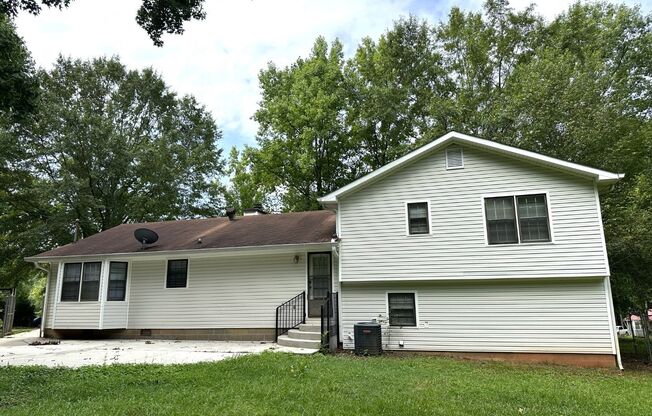 Prime 30265 location! Huge back yard, large wood shop in basement, large grass area & storage building, LVP flooring, large master suite, custom closets!