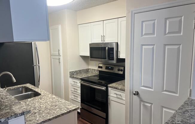 a kitchen with a stove and a sink