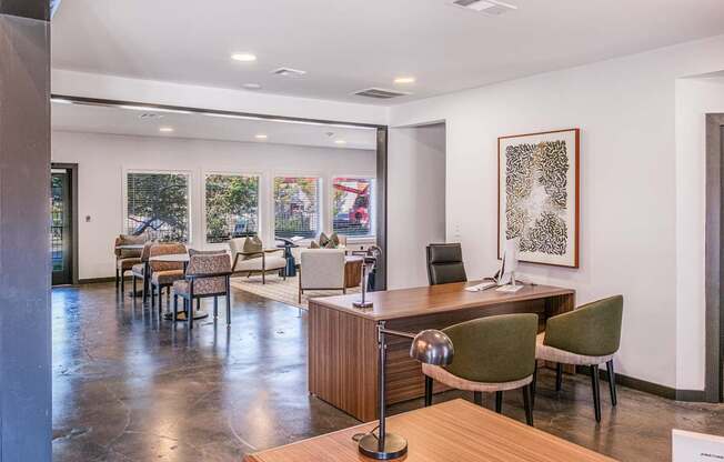 A conference room with a long table and chairs.